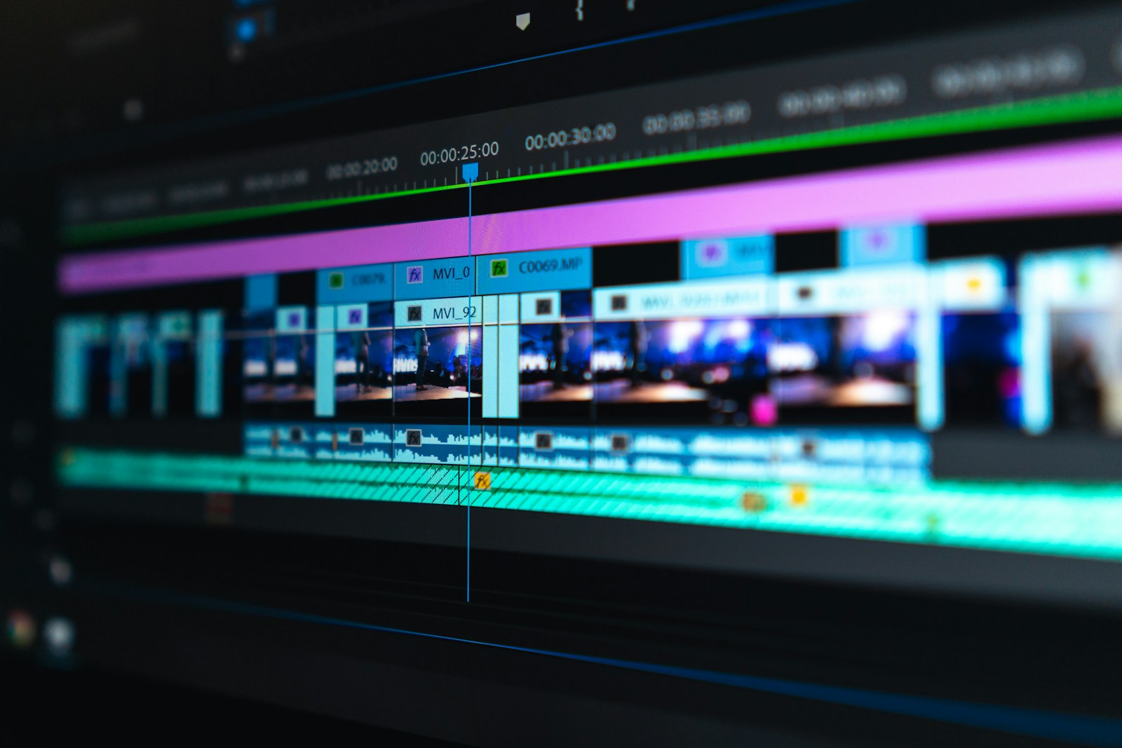 Creative director reviewing motion ad cut-downs with a media strategist